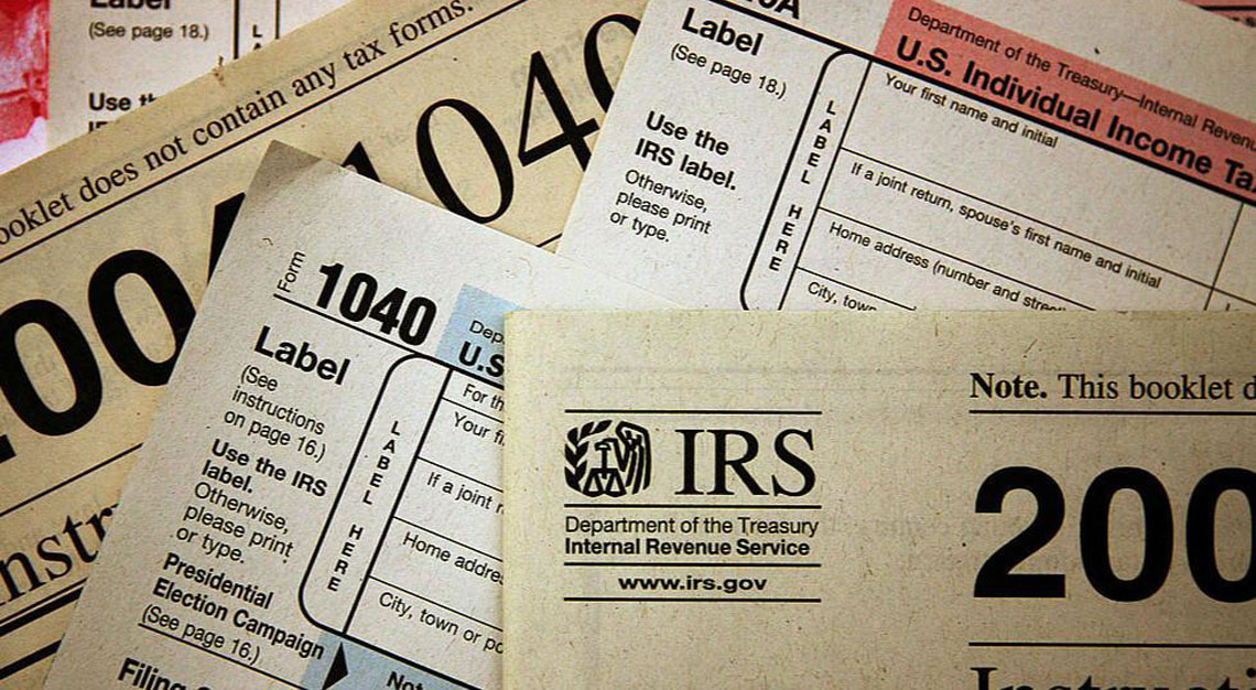 a bunch of IRS tax forms are displayed on this image